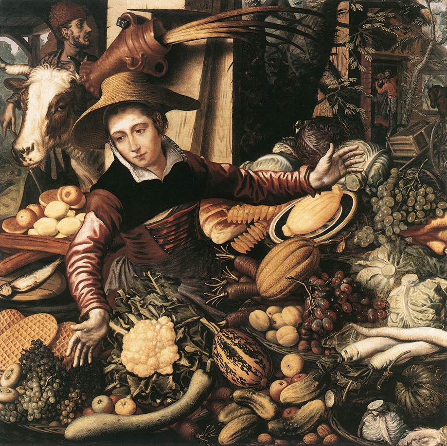 Femme du marché avec étal de légumes