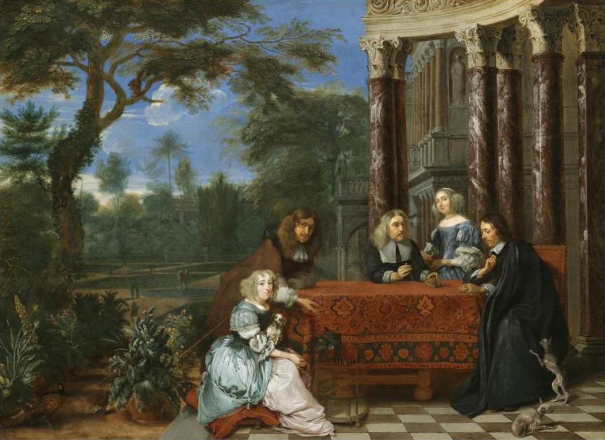 Famille assise à une table dans un élégant jardin