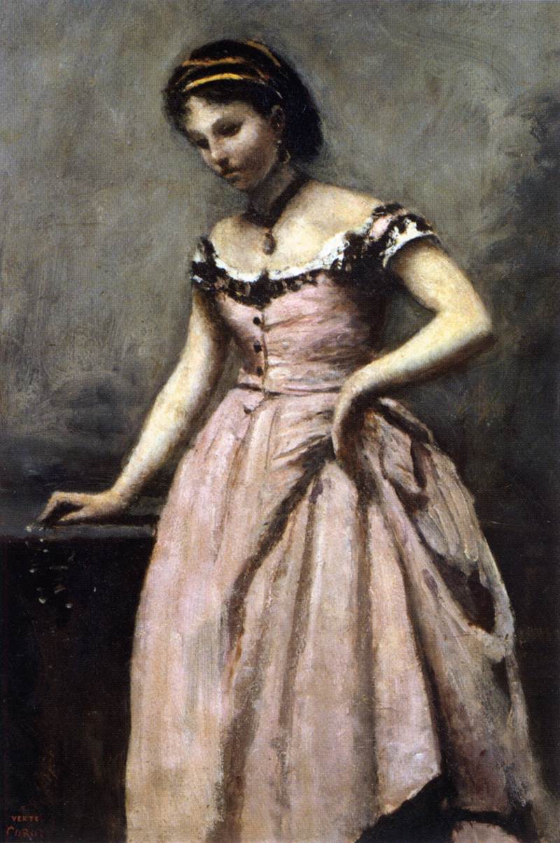 Jeune femme en robe rose