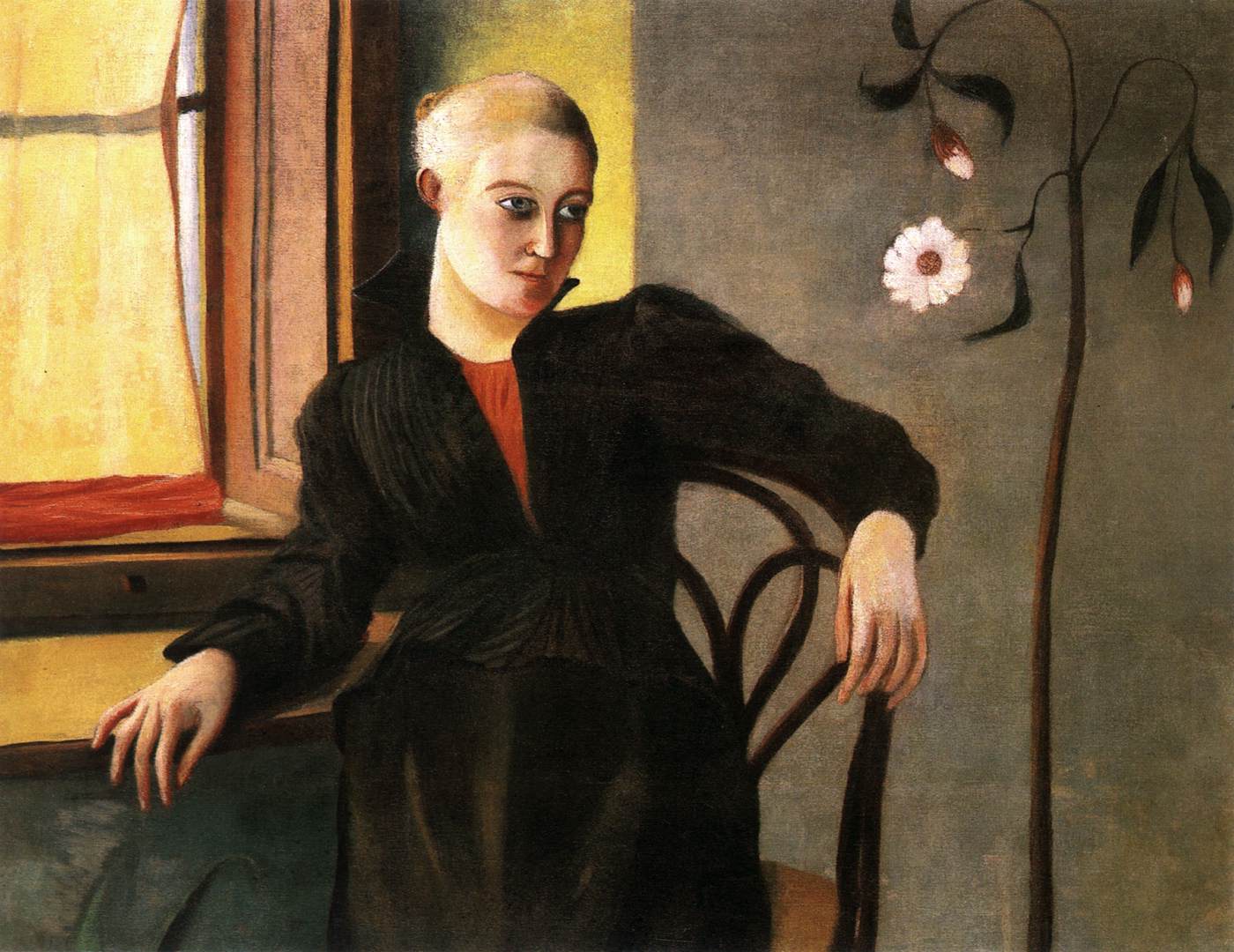 Femme assise près de la fenêtre
