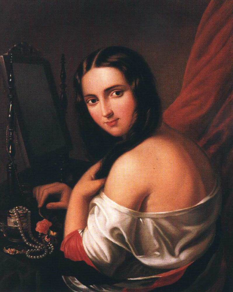 Femme assise devant un miroir