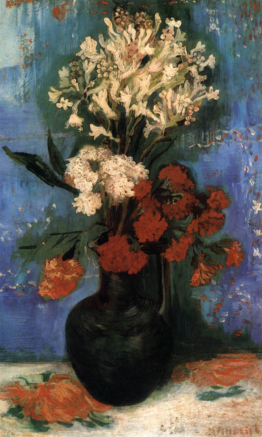 Vase avec des œillets et d'autres fleurs