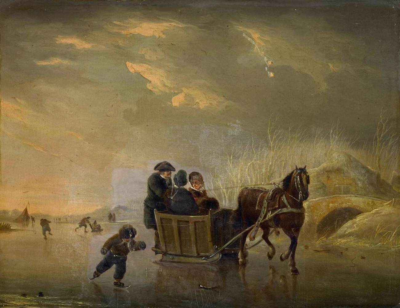 Traîneau et patineurs sur la glace