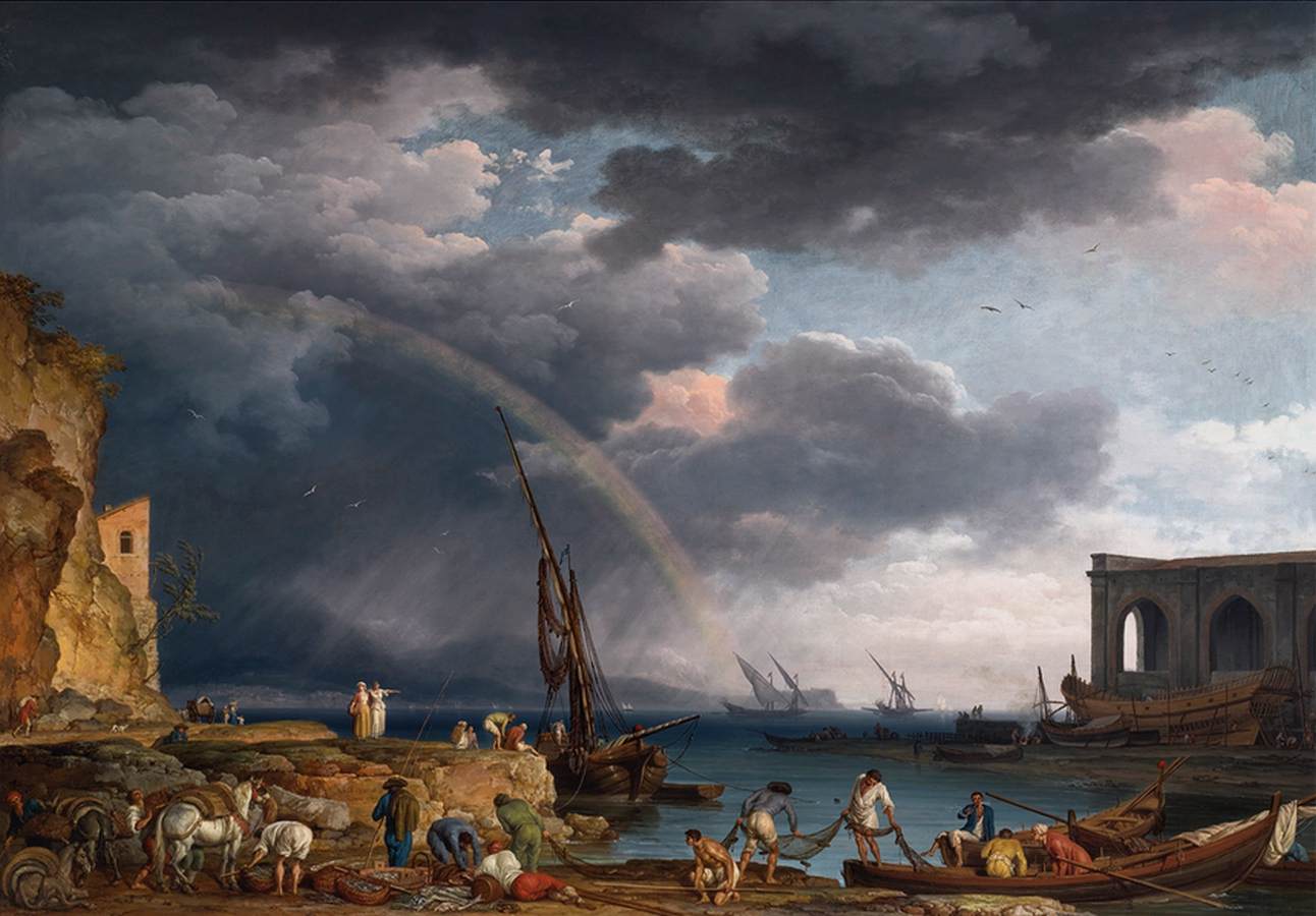 Vue côtière avec un arc-en-ciel